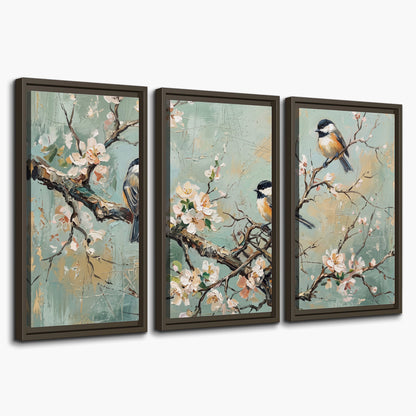 Small colorful songbirds perched among pale blossoms on soft aqua 3 piece framed canvas wall art on a white background