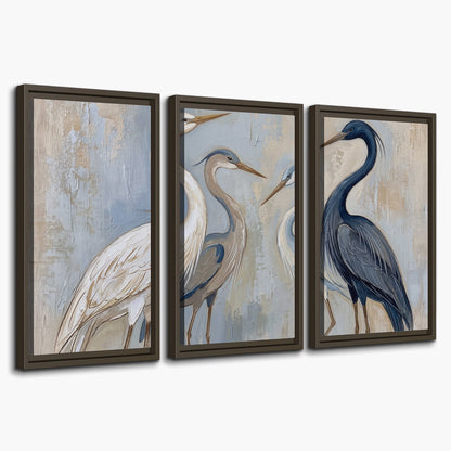 Three long-necked herons in soft ivory and dark blue against pale blue-gray 3 piece framed canvas wall art on a white background