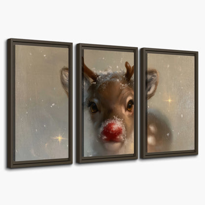 A young reindeer with a bright red nose surrounded by soft snowflakes and tiny painted stars 3 piece framed canvas wall art on a white background