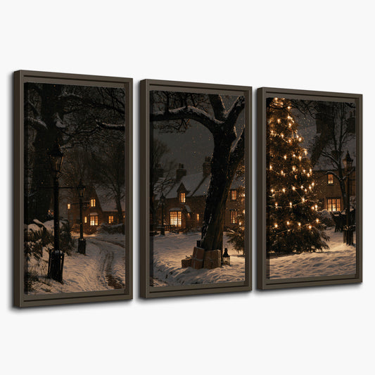 A tall illuminated Christmas tree beneath dark branches beside warmly lit snowy cottages 3 piece framed canvas wall art on a white background