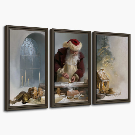 Santa working with dough beside a gingerbread house in a softly lit Christmas kitchen 3 piece framed canvas wall art on a white background