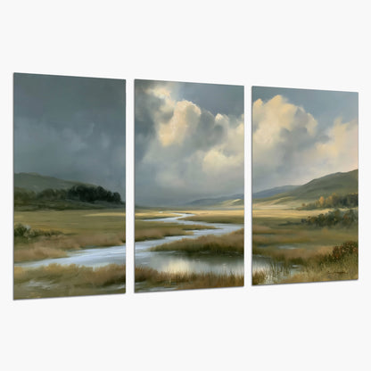 A winding stream through an open meadow beneath large sunlit clouds set of 3 poster prints on a white background
