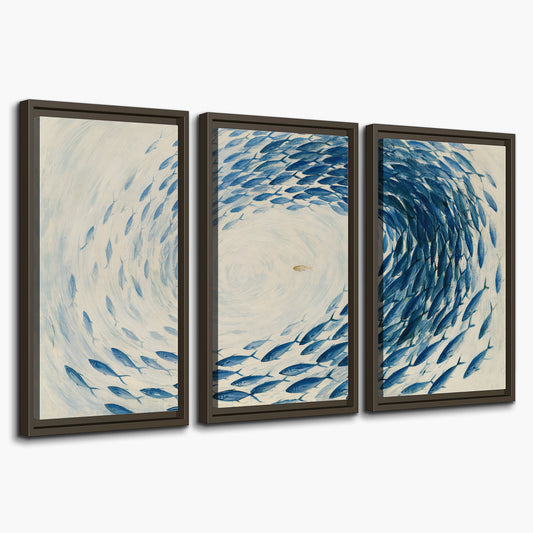 A circular school of blue fish flowing around a pale open center 3 piece framed canvas wall art on a white background