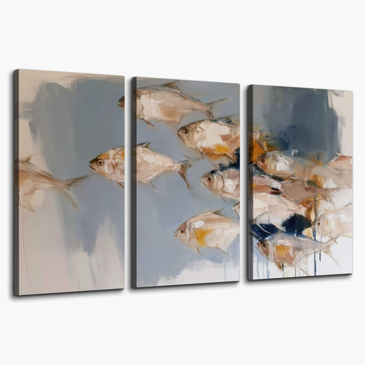 Small blue and golden fish moving across a pale layered abstract background 3 piece canvas wall art on a white background