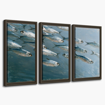 A school of silver fish moving together through cool blue water 3 piece framed canvas wall art on a white background