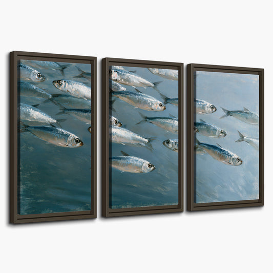 A school of silver fish moving together through cool blue water 3 piece framed canvas wall art on a white background