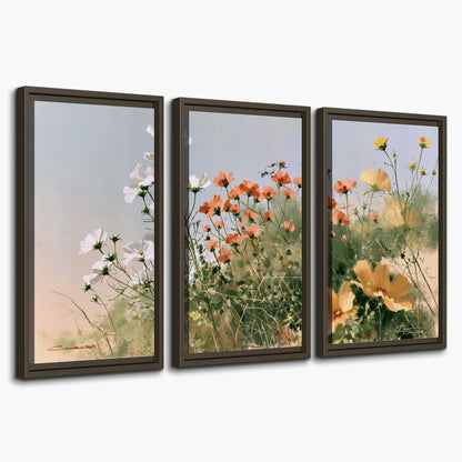 White and orange meadow flowers with fine green stems under a pale sky 3 piece framed canvas wall art on a white background