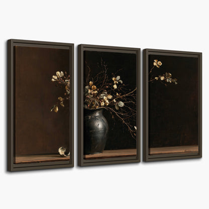 Fine flowering branches in a small dark vase on a wooden table against a deep brown background 3 piece framed canvas wall art on a white background