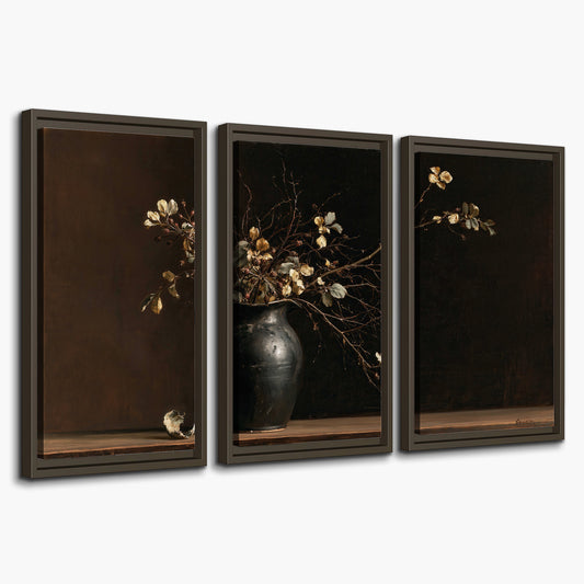 Fine flowering branches in a small dark vase on a wooden table against a deep brown background 3 piece framed canvas wall art on a white background