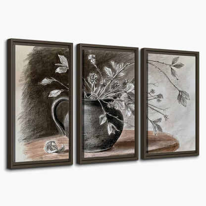 Fine leafy branches spilling from a dark rounded vase in a soft monochrome still life 3 piece framed canvas wall art on a white background