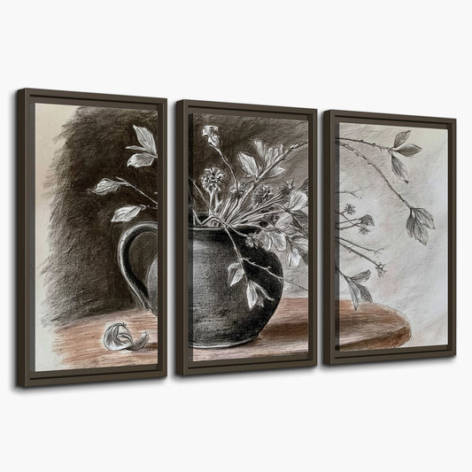 Fine leafy branches spilling from a dark rounded vase in a soft monochrome still life 3 piece framed canvas wall art on a white background