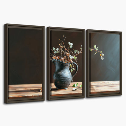 A delicate arrangement of pale blossoms in a blue vase on a sunlit wooden table 3 piece framed canvas wall art on a white background