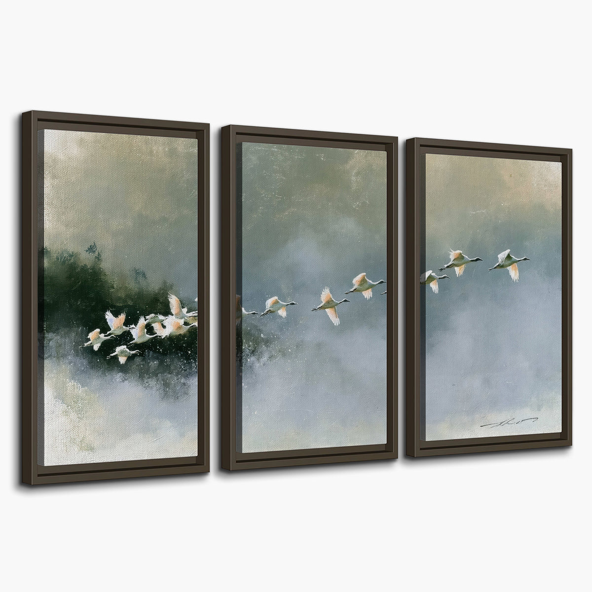 A flock of white birds flying low above a quiet blue-green lake 3 piece framed canvas wall art on a white background