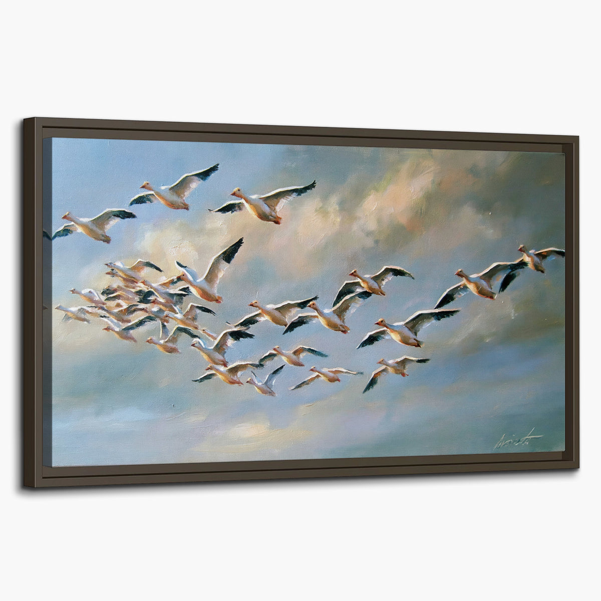 A flock of pale seabirds gliding beneath soft clouds across a blue sky single framed canvas wall art on a white background
