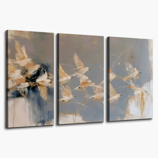 Pale bird-like forms sweeping across layered strokes of blue, ochre and cream 3 piece canvas wall art on a white background