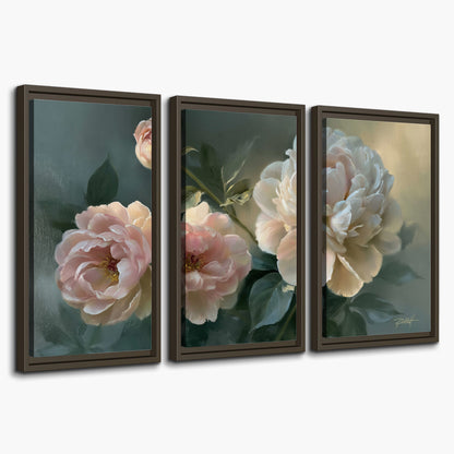 A large cream peony beside blush flowers and broad green leaves 3 piece framed canvas wall art on a white background