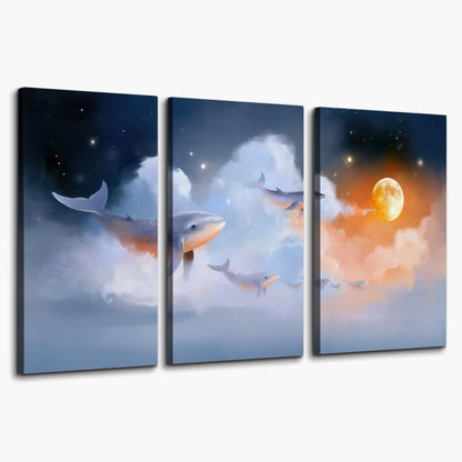 Blue whales gliding through pastel clouds beneath stars and a warm orange moon 3 piece canvas wall art on a white background
