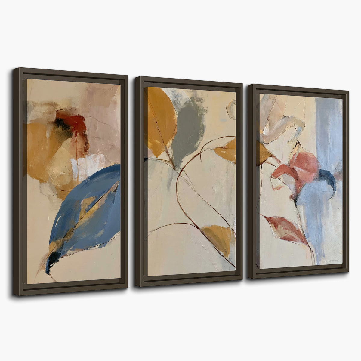 Loose ochre, blue and pink leaves arranged on a pale layered background 3 piece framed canvas wall art on a white background