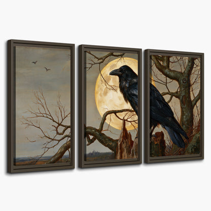 A dark raven perched on a branch beneath a warm moon in a shadowed woodland 3 piece framed canvas wall art on a white background