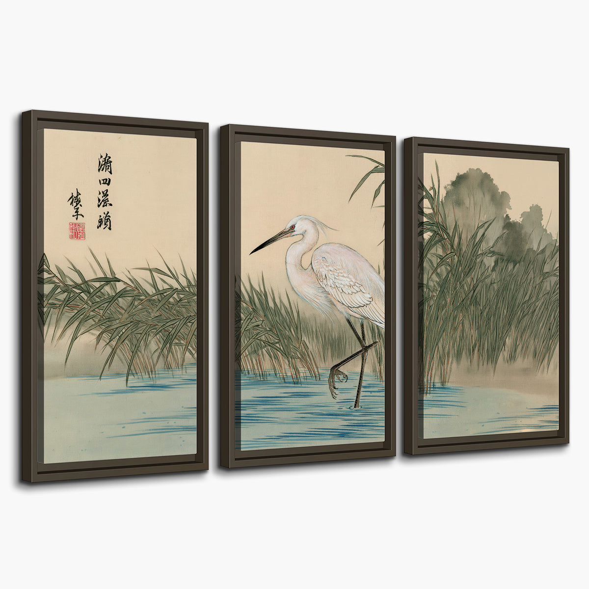 A white heron standing beside a quiet river with reeds and distant hills 3 piece framed canvas wall art on a white background
