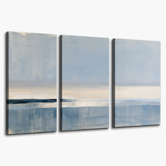 A minimal blue seascape with a pale horizon and soft vertical reflections 3 piece canvas wall art on a white background