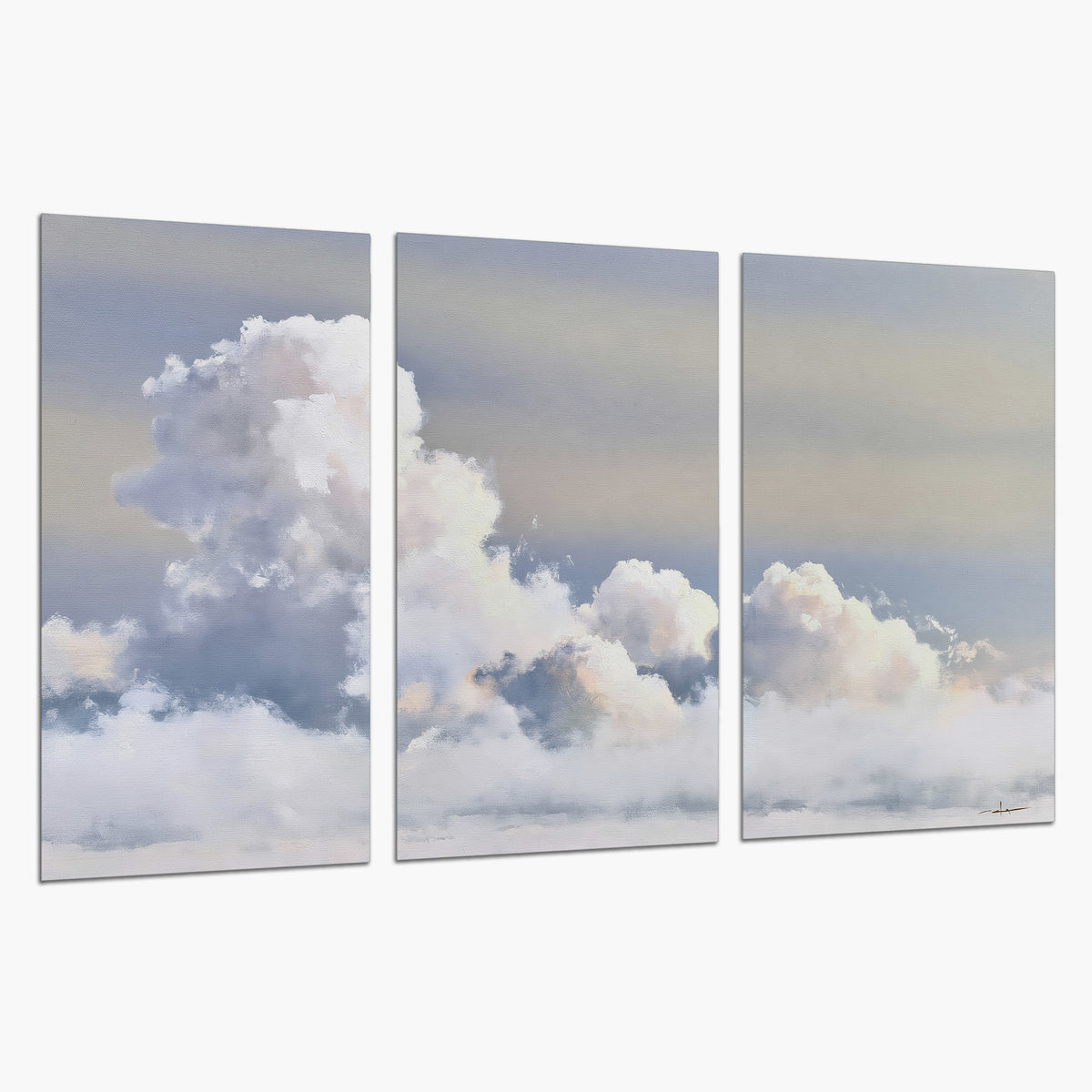 Large white clouds rising through a pale blue sky with gentle warm highlights set of 3 poster prints on a white background