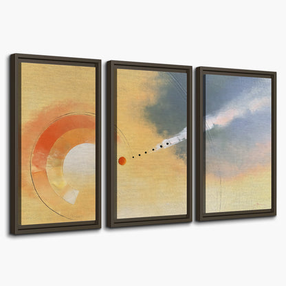 A warm orange circular form and diagonal pale streaks across a muted yellow and blue field 3 piece framed canvas wall art on a white background