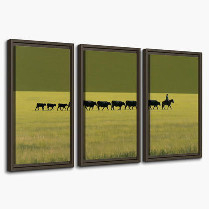 A rider leading a long line of cattle across a wide green and golden plain 3 piece framed canvas wall art on a white background