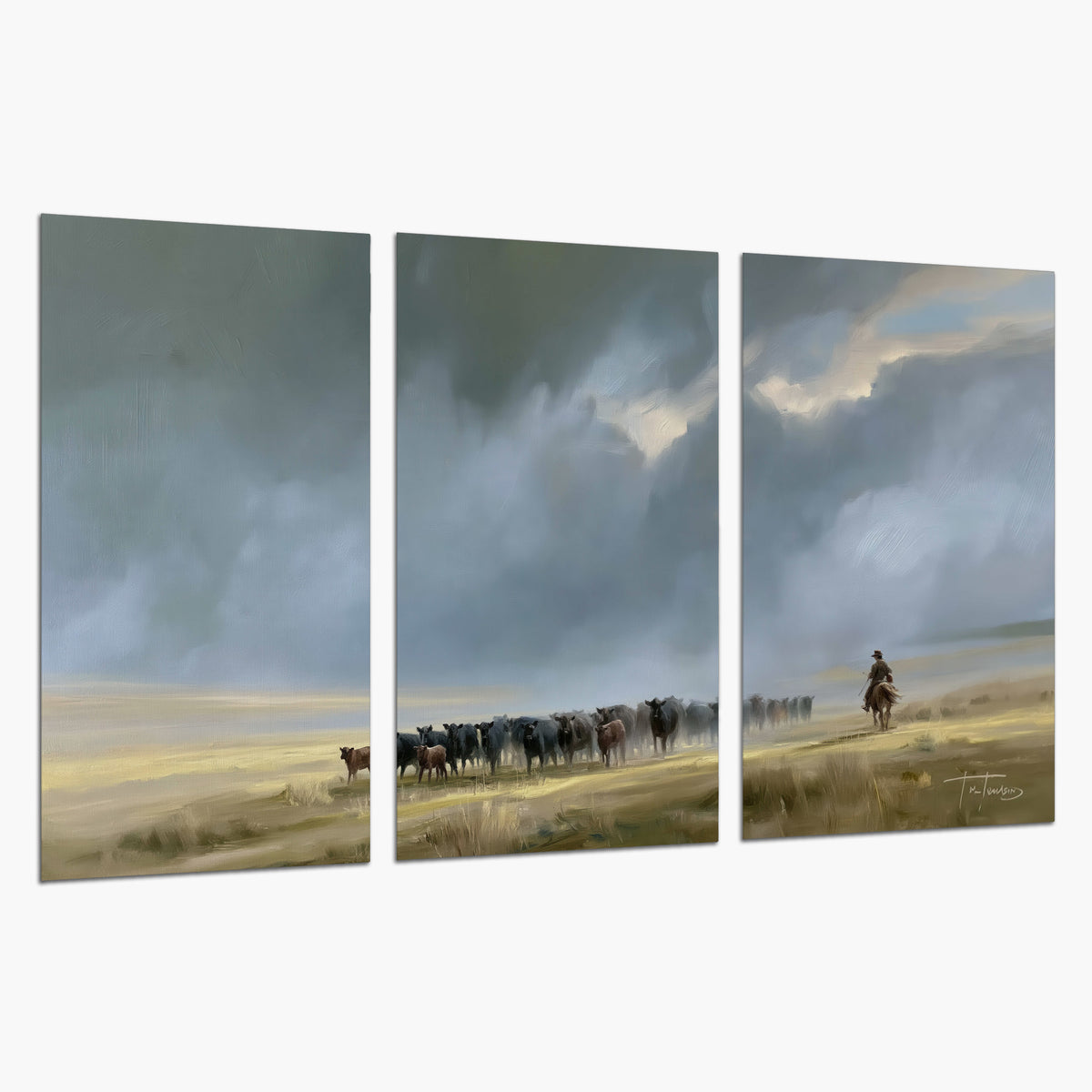 A rider and cattle moving across a sunlit grassland beneath a dramatic blue-gray sky set of 3 poster prints on a white background