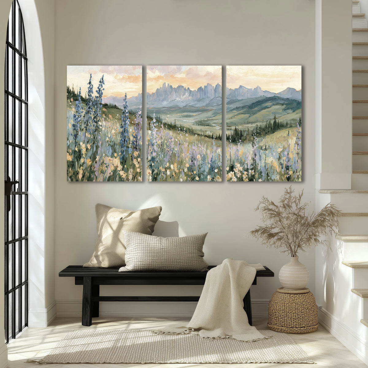 Mountain wildflower valley painting 3 piece canvas wall art in an entryway above a bench
