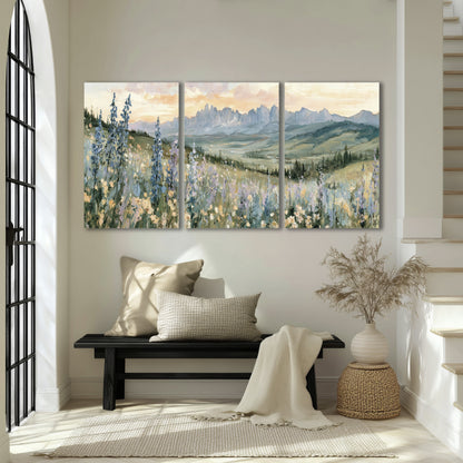 Mountain wildflower valley painting 3 piece canvas wall art in an entryway above a bench