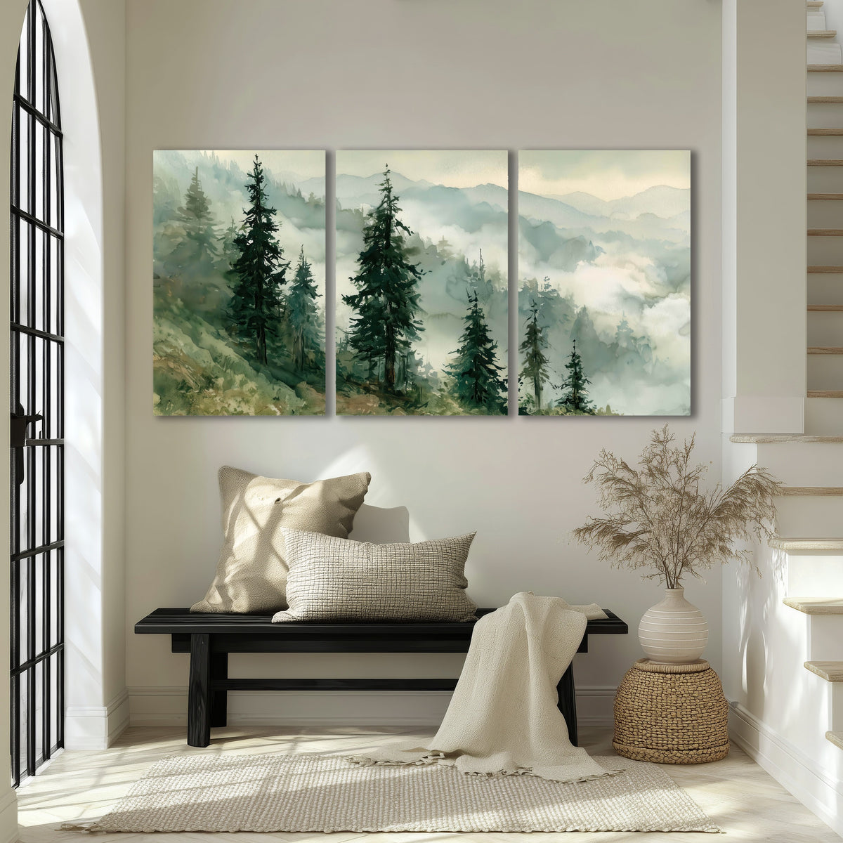 Misty mountain pines watercolor 3 piece canvas wall art in an entryway above a bench