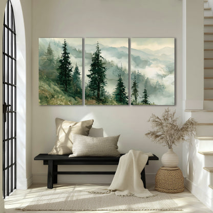 Misty mountain pines watercolor 3 piece canvas wall art in an entryway above a bench