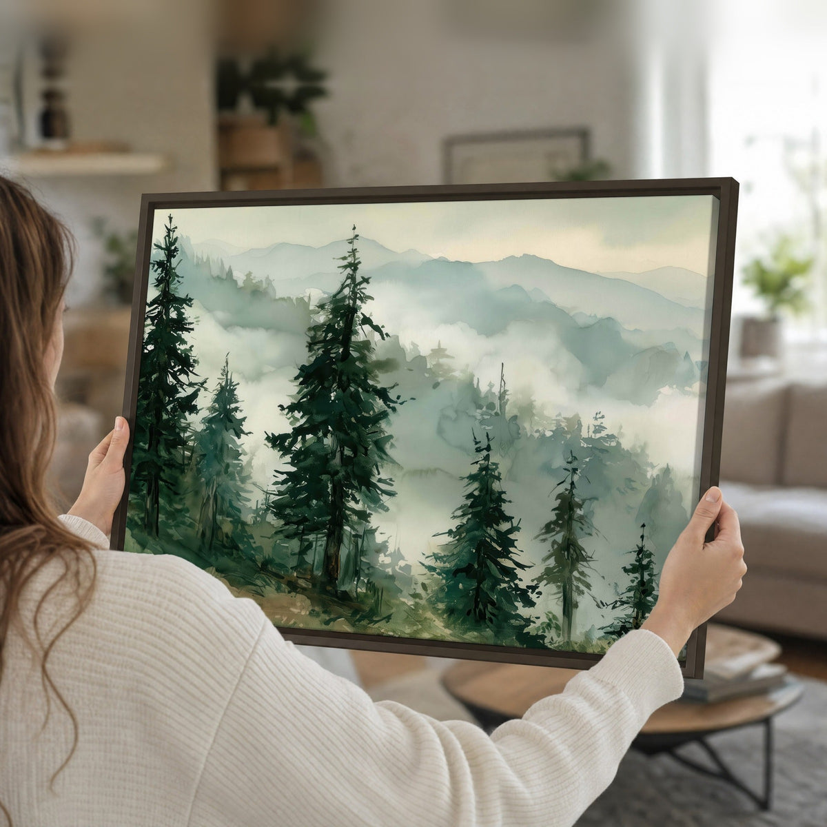 Misty mountain pines watercolor framed canvas held in hands