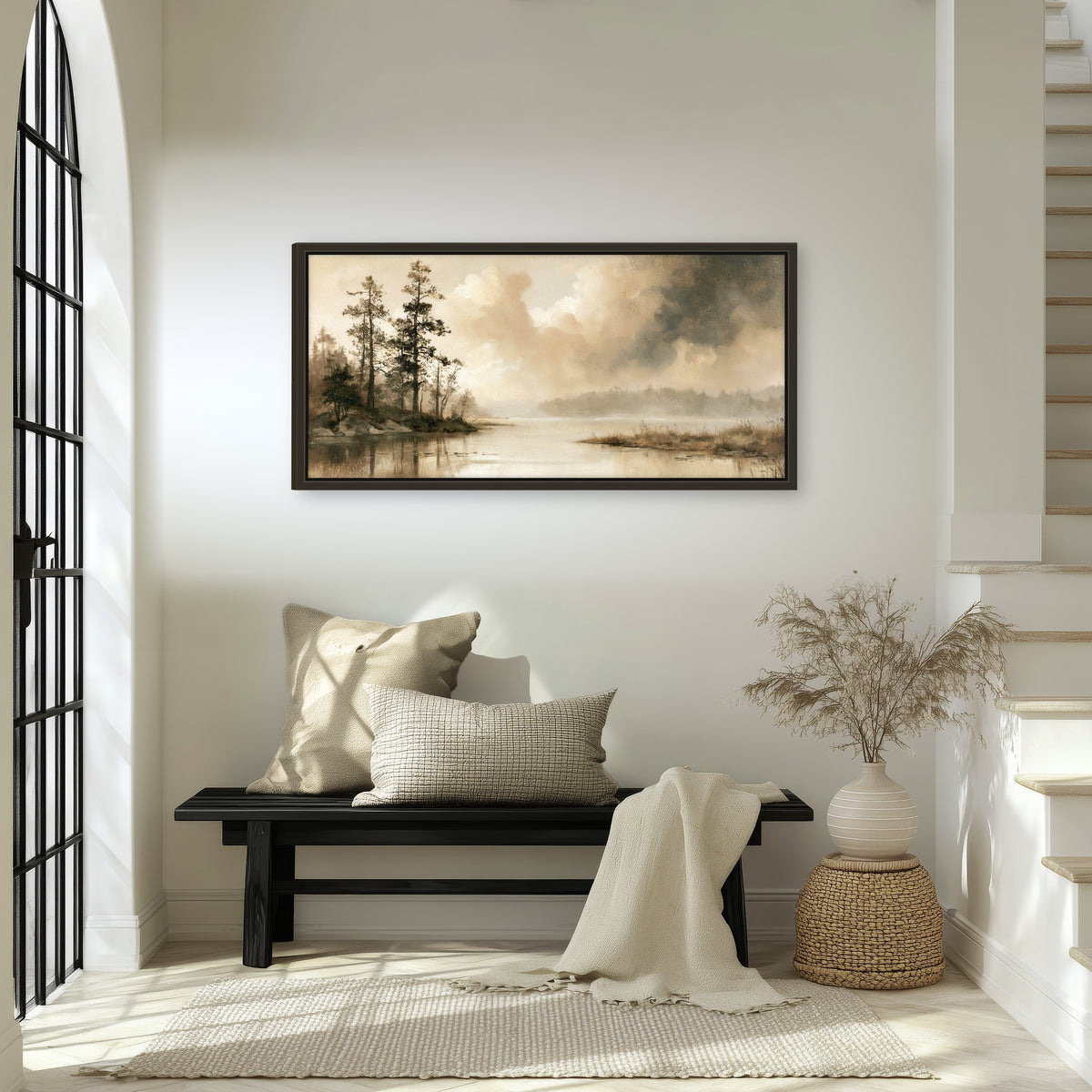 Vintage sepia pine lake painting framed canvas wall art in an entryway above a bench