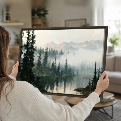 Misty pine lake mountain painting framed canvas held in hands