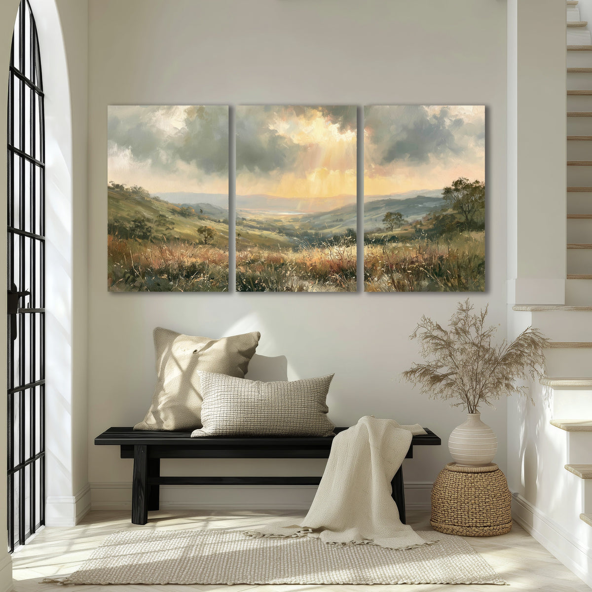 Golden sun rays valley painting 3 piece canvas wall art in an entryway above a bench