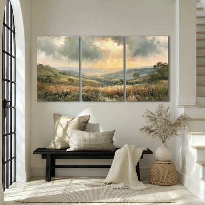 Golden sun rays valley painting 3 piece canvas wall art in an entryway above a bench
