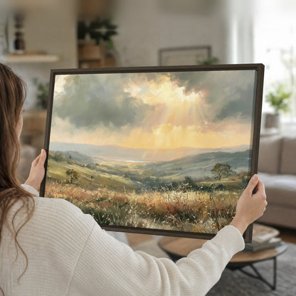 Golden sun rays valley painting framed canvas held in hands