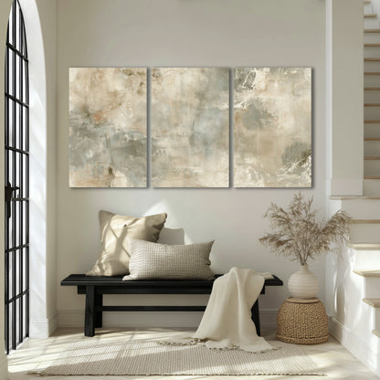 Neutral marble abstract painting 3 piece canvas wall art in an entryway above a bench