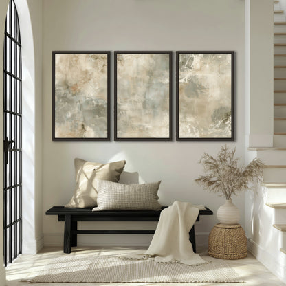 Neutral marble abstract painting 3 piece framed canvas in an entryway above a bench