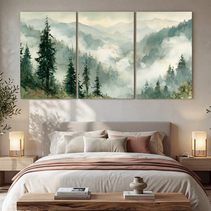 Watercolor misty mountain forest painting 3 piece canvas wall art in a bedroom above the bed
