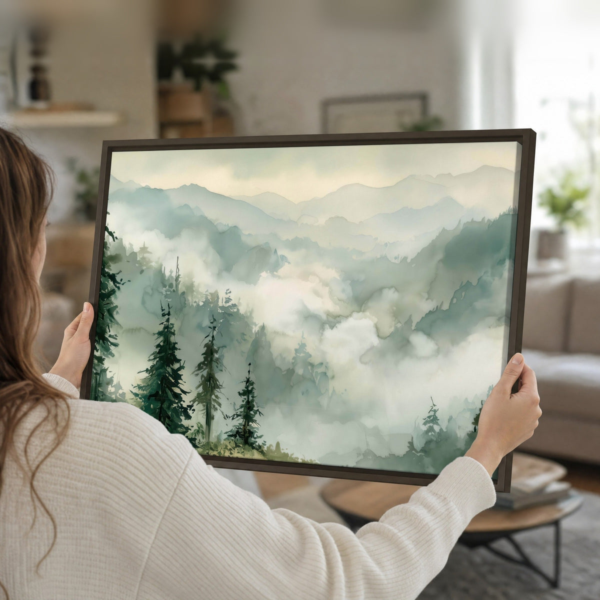 Watercolor misty mountain forest painting framed canvas held in hands