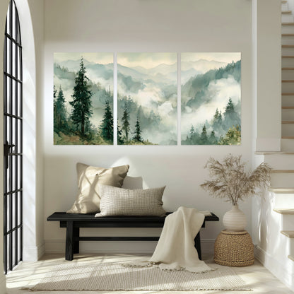 Watercolor misty mountain forest painting set of 3 poster prints in an entryway above a bench