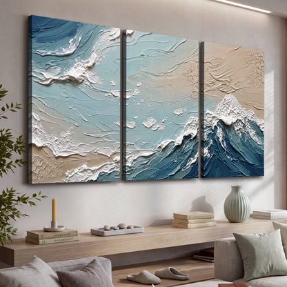 Textured ocean wave painting 3 piece canvas wall art in a living room above a console
