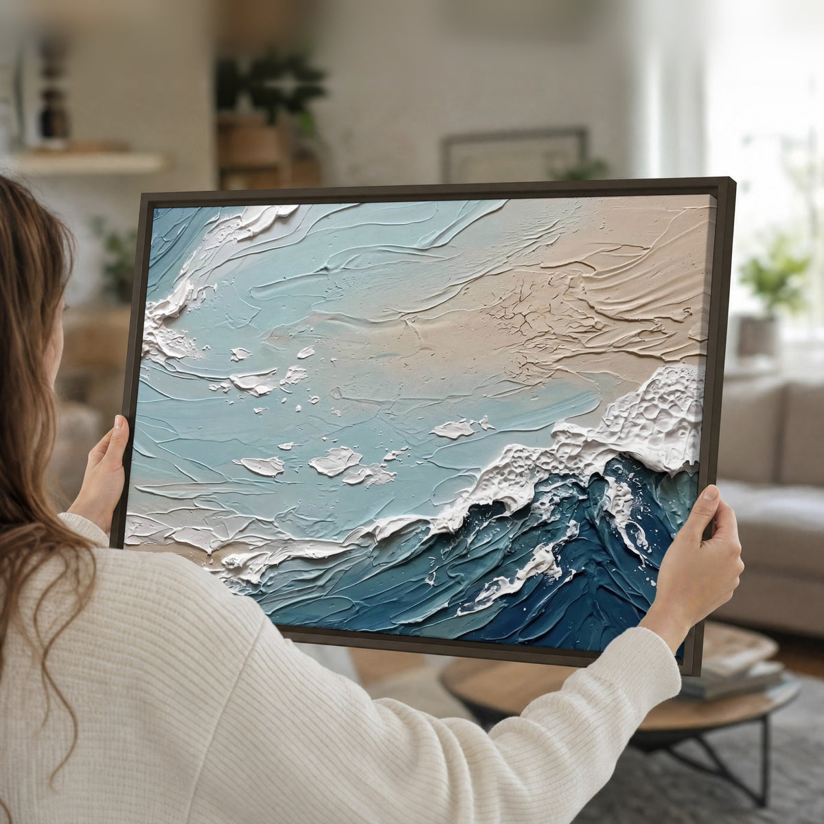 Textured ocean wave painting framed canvas held in hands