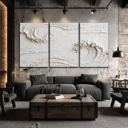 White plaster wave art 3 piece canvas wall art in an industrial loft