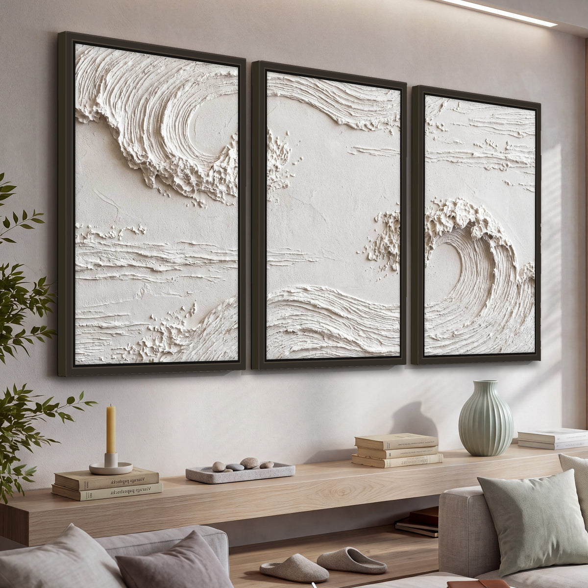 White plaster wave art 3 piece framed canvas in a living room above a console