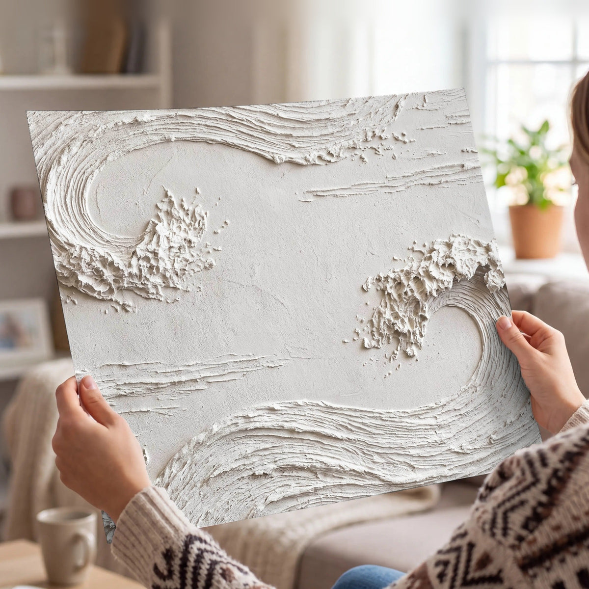 White plaster wave art poster print held in hands
