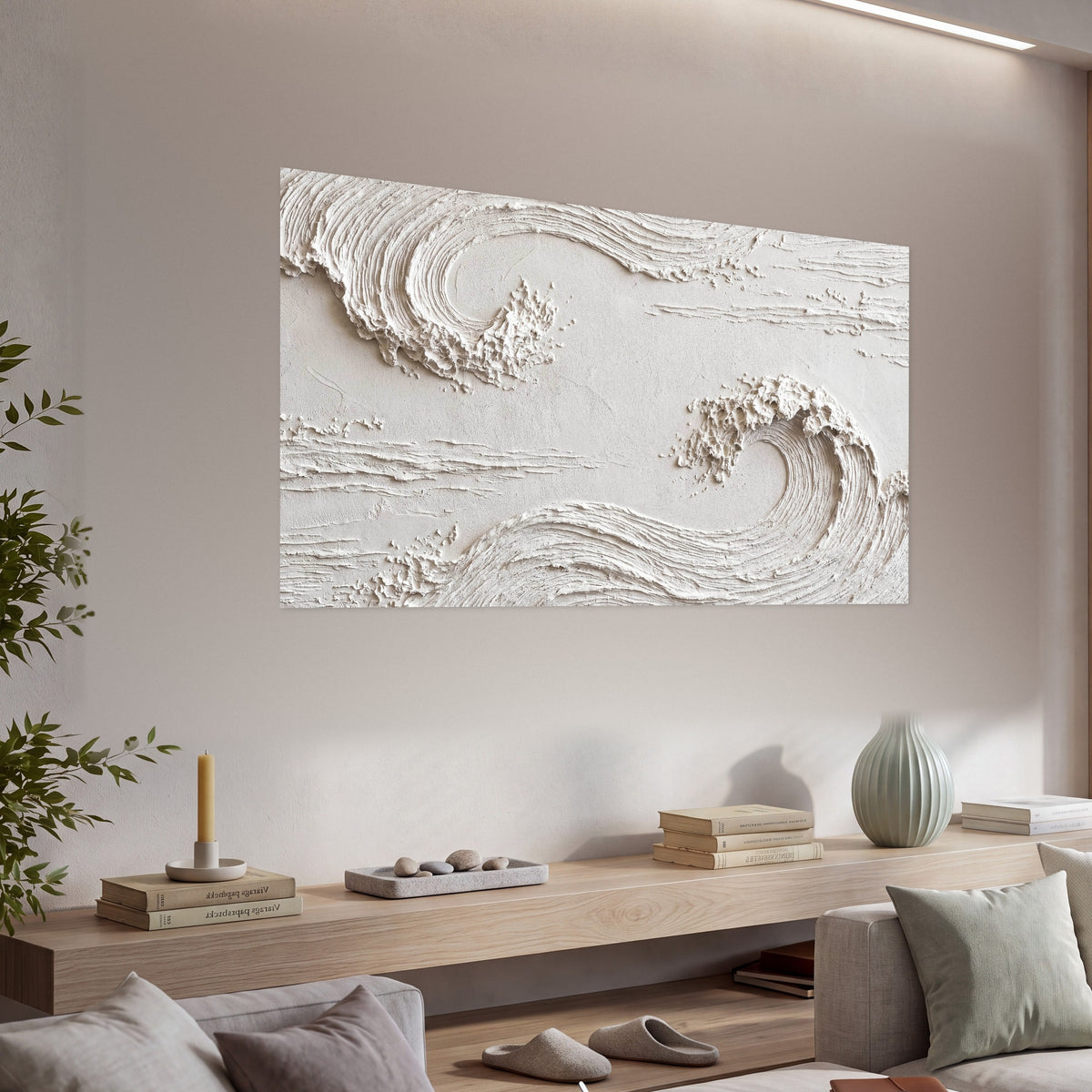 White plaster wave art poster print in a living room above a console